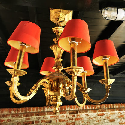 heavy brass chandelier with red shades vintage reclaimed